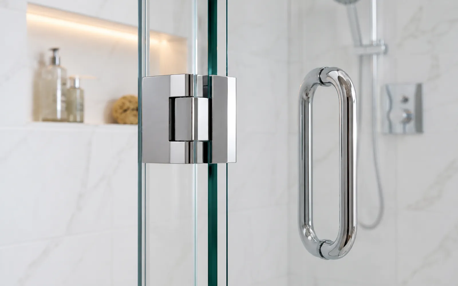 Frameless shower glass hardware detail